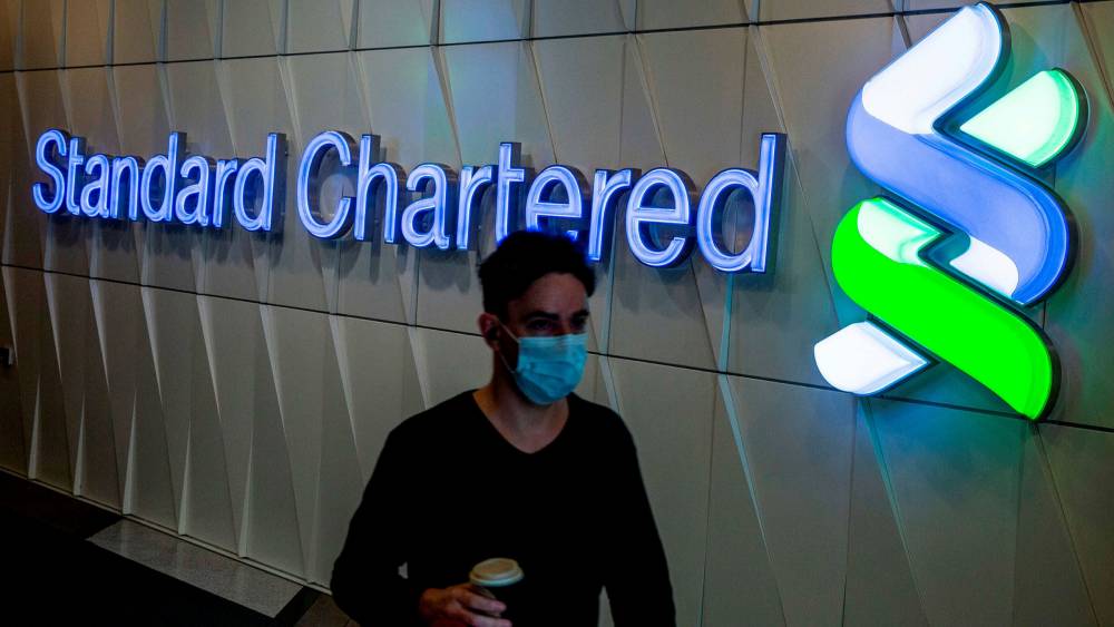 Standard Chartered intended to close half of its physical branches